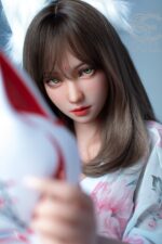Grünäugige japanische realistische sexpuppe